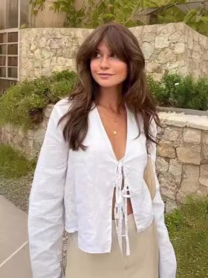 Deep V-neck flared sleeve tie-front top